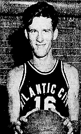 Basketball player Ed Poorman of the Morris Guard, New Jersey, with ATLANTIC CITY uniform, holding basketball. From the Atlantic City Press, March 10, 1952, Atlantic City, New Jersey.