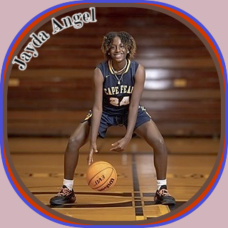 Image of Jayda Angel, girls basketball player at Cape Fear High School in North Carolina. Posing in uniform #24, crouching, legs apart, dribbling ball between them.