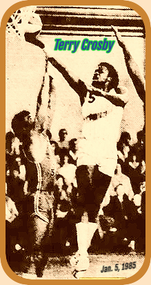 Terry Crosby, #5 fir Bolton in the National Basketball League  in England, shown high in air at basket laying the ba;ll in  right-handed, above the Leicester team when he scored 60 points on January 5, 1985. From the Leicester Mercury, Leicester, England, January 7, 1985.
