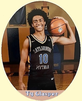 Ty Glasper, Gatlinsburg-Pittman High School (Tennessee) shown in blue on black uniform number 10, holding basketball on left shoulder with left arm, smiling.