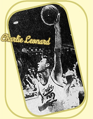 Image of #22, Charlie Leonard of the Dobyns-Bennett High School basketball team, in his scripted Tribe uniform throwing up a jumping left handed hook shot. From the Kingsport Times-News, Kingsport, Tennessee, December 8, 1957.