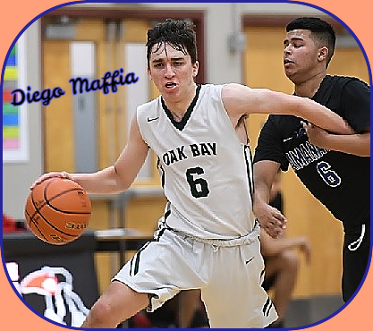 Diego Maffia, Oak Bay High basketball player in British olumbia 2019, #6 with ball, left arm held by defender.