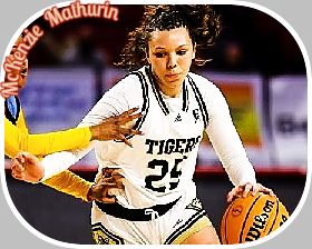 Image of McKenzie Mathurin, Broken Arrow High School (Oklahoma) dribbling basketball around defender in white #23 TIGERS jersey. (Tulsa World)