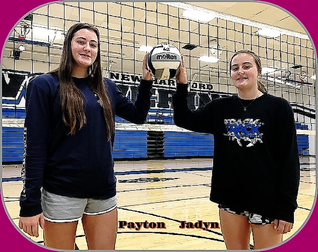 Image of the the Petersen twin sisters, Payton (on the left) and Jadyn (right), posing in front of a volleyball net. They were also volleyball stars for Dike-New Hartford High School (Iowa).
