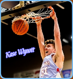 Image of Kase Wynott, Lapwau High School (Idaho) hanging on the rim after dunking the ball, in blue #51 jersey. From 2022-2023.