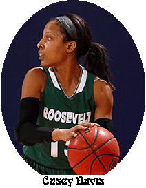 Casey Davis, Roosevelt University girls basketball player, with ball, in a game.