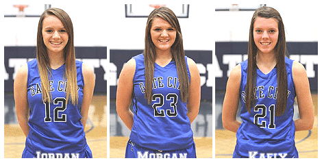 The Gose sisters of Gate City (Virginia) High School Lady Blue Devils basketball players, Jordan (number 12), Morgan (number 23) and Kaely (number 21), in their blue uniforms.