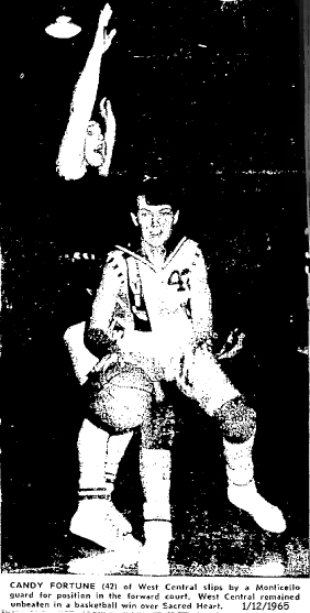 Candy Fortune, number 42, of West Central High School of Maynard, Iowa, in a 1/12/1965 basketball game against Sacred Heart of Monticello...slips by a Monticello guard for position in the forward court. West Central remained unbeaten in a basketball win over Sacred Heart. Oelwein Daily Register for January 13,1965; final score, West Central 74- Monticello 39, Candy Fortune scored 7 points on 3 field goals and a foul shot.