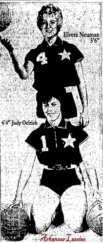 Picture of 5-foot 6-inch Elvera Neuman, number 4, and 6-foot 4-inch Judy Oelrich, number 1, members of the Arkansas Lassie women's professional basketball team, c.1970.