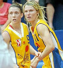 Image of City Power's Natalie Hurst and player-coach Jess Bibby, in action in a Queensland Basketball League game.