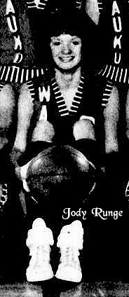 Picture of Jody Runge, seated, with basketball, in Waukon uniform. From The Telegraph-Herald, Dubuque, Iowa, March 5, 1979.