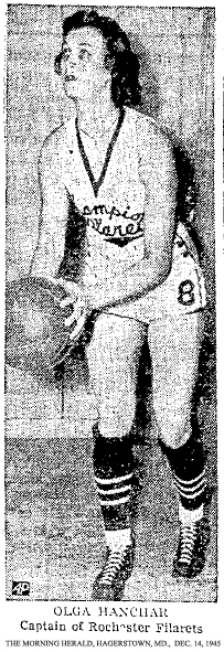 Picture of Olga Hanchar, Captain of Rochester Filarets, from The Morning Herald, Hagerstown, Maryland, December 14, 1945. She was one of two who had been on the team from the beginning of the winning streak in 1937, the other being Mrs. Bernice Bielaski Riker, just released from the WACs. Other starters were 6-foot 4-inch center Dorothy Gulczewski, Freda Savona and Lymp Savona, her sister, and Susie Sponseller. Reserves included Doris Stockdale, just out of the WAVEs, and Brunhilda Sommers, a senior at Brockport State. The winning streak was at 170 straight.