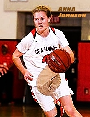 Image of girls basketball player, Anna Johnson, from Redondo High School (California), in action, white SEA HAWKS uniform, dribbling the ball.