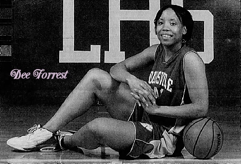 Mississippi girls basketball player, Dee Forrestm Louisville High School posing sitting with legs to left, right knee up, left elbow resting on ball. From The Clarion-Ledger, JAckson, Mississippi, March 27, 2004. Photo by J.D. Schwalm.