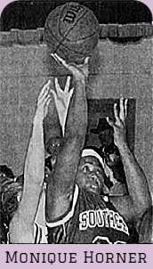 Monique Horner, Southeast Lauderdale High School, under the basket, jumping up, ball in right hand trying to score a bucket. From The Clarion-Ledger, Jackson, Mississippim November 18, 2000.