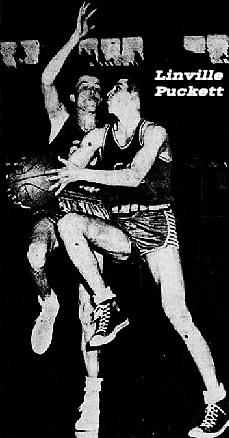 Image of Kentucky boys basketball player, Linville Puckett, Clark County High School, Going up for a lay-up, in air, right leg bent, being guarded by D. Smith of the Somerset High Briar Jumpers. From The Courier-Journa, Louisville, Kentucky, March 21, 1952. Photo by Al Blunk.