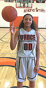 Ahlana Smith, Vance High (Charlotte, North Carolina) girls basketball player, #00, spinning a basketball with his right index finger.