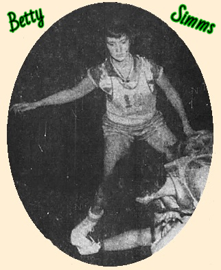 Image of Tennessee girls basketball player, Betty Simms, of Ramer High School's team, on defense in her #12 uniform. From The Jackson Sun, Jackson, Tennessee, December 23, 1953. Photo by Jimmy Shearin.