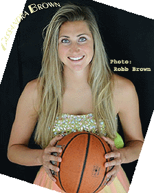 Cassandra Brown, Fulton High (British Columbia) basketball player, in beige gown with basketball. Phot by Robb Brown.