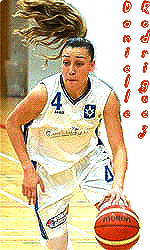 Image of Danielle Rodriguea, women's basketball player for Iceland Dominos Express League Stjarnan tea,. In white uniform with blue #4 dribbling ball, poney-tail flying.