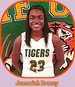 Portrait Image of girls basketball player, Jacorriah Bracey, Ruleville Central High School, Mississippi, in #23 TIGERS white uniform.