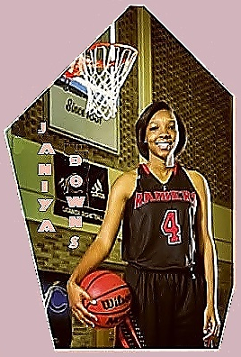 Janiya Downs, North Carolina girls basketball player for South Rowan High School, posing with basketball in front of basket in RAIDERS #4 uniform, white trimmed red lettering on dark black background.