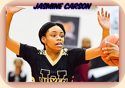 Jasmine Carson, girls basketball player from Tennessee's Whitehaven High School, with ball overhead, defending..