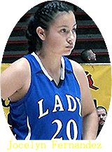 Image of Jocelyn Fernandez, Lady Horseman for he St. Michael's High girls basketball team. In blue uniform, number 20, looking to our right.