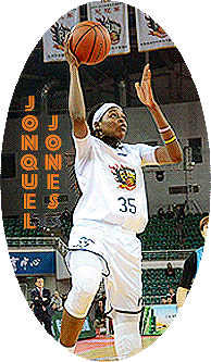 Image of Jonquel Jones, basketball player of the Shanxi Flames Women's Chinese Basketball League player, going up for a shot in white #35 uniform with Flames logo on front.