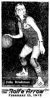 Picture of Julie Brinkman, number 21, dribbling the ball as a member of the Rolfe High Rammettes (Iowa). From The Rolfe Arrow, February 15, 1973.