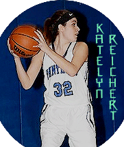 Image of New Jersey girls basketball player, Katelyn Reichertof Wallington High. In her white jersey, black outlines blue lettering, #32 “PANTHERS” holding the ball with two hands, looking to pass to our right.