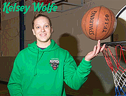 Kelsey Wolfe  in Portlaoise Panthers sweayshirt, with basketball, posing near basket