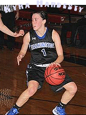Picture of Kyra Hardesty, Washington High School basketball player, in Bluejay uniform, number 1, dribbling the ball, in action, in dark blue uniform with light blue lettering.