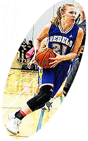 Image of Mackenzie Smith driving to the basket in a blue REBELS unform, #21, with white lettering and numerals and double vertical yellow stripes on the sides.