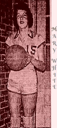 Picture of Mary White, girls basketball player for Fair Play High School, in South Carolina, in 1962, posing in front of a brick wall in her white #15 uniform, standing, holding a basketball. From The Greenville News, Greenville, South Carolina, February 11, 1962. 'Upstate Stars' Selection.'
