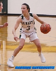 Action shot of Madison Mathiowetz. Minnesota girls high school basketball player, 2019. for Sleepy Eye St.Mary's High, in white uniform, number 3. trying to dribble ball upcourt.