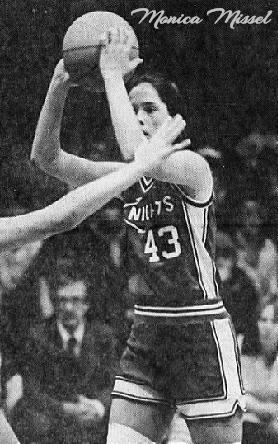 Game image of Monica Missel, girls basketball player for Assumption High School, Davenport, Iowa, with ball over her head, looking to pass. Looking to our left, uniform #43. From the Quad-City Times, Davenport, Iowa, December 24, 1981.