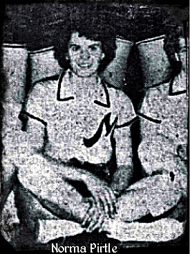 Image of Norma Pirtle, girls basketball player for Medina High (Tennessee), cropped from team photo, sitting cross legged on floor in uniform with large script M on the leeft side of jersey. From The Jackson Sun, Jackson, Tenn., Dec. 30, 1953.