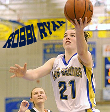 Image of Robbi Ryan, Sheridan High School girl basketball player (in Wyoming), number 21, with basketball in left hand trying for a lay up.