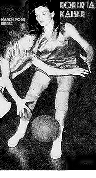 Image of Roberta Kaiser, Byng High girls basketball player, defending Karen York of Dibble High, dribbling the basketball. From the Ada Evening Tribune, November 25, 1955.