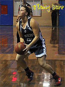 Image of Stacey Barr, in blue Willetton Tigers uniform about to shoot towards our left.