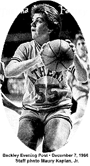 Black and white image, in game, of Thelma Farley, Athens High School (West Virginia), #55, looking to pass ball. From Beckley Evening Post, December 7, 1986. Staff photo: Maury Kaplan, Junior.