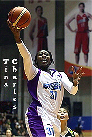 Image of Tina Charles, going up for a layup, in her white Sichuan Whale uniform, number 31.