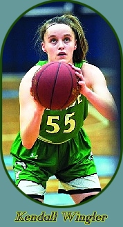 Image of Kentucky girls basketball player, Kendall WIngler, Meade High Lady Wave, shooting a foul shot in her green #55 uniform.