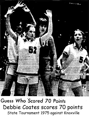Picture of Deb Coates, Mediapolis forward, scoring 70 points in a March, 1975 State Basketball Tournament game against Knoxville; she is being guarded by three players, Pam Marsh, Joanie Stickle, and Karen Rowley.