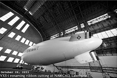 Photo of the October 26, 2011 renaming ceremony at NAS Lakehurst. View of blimp inside NAWCAD blimp hanger. MZ-3A newly designated as Scientific Development Squadron ONE (VXS-1), and given U.S. Navy markings..