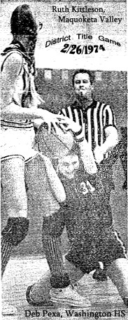 Picture of Iowa 6-on-6 basketball player, Deb Pexa, number 31, of Washington High, on floor in a tie-up for a jump ball, with Maquoketa Valley's star Ruth Kittleson, in a District Title game at Kennedy High in Cedar Rapids, on February 26, 1974. Final score, Maquoketa Valley 56 to 51 win. From The Cedar Rapids Gazette, Feb. 27, 1974. Gazette Photo by John McIvor.